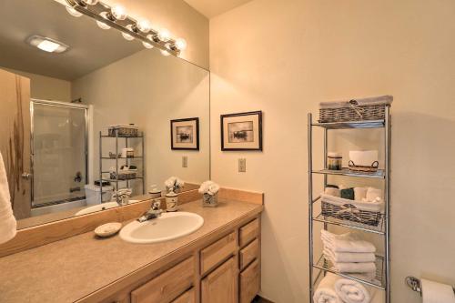 a bathroom with a sink and a mirror at Rustic Home on Whitefish Mountain, Near Ski Run! in Whitefish