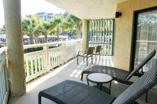 a patio area with a patio table and chairs at Omni Hilton Head Oceanfront Resort in Hilton Head Island