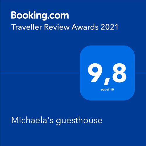 a screenshot of a notification of a travel review award at Michaela's guesthouse in Nafplio
