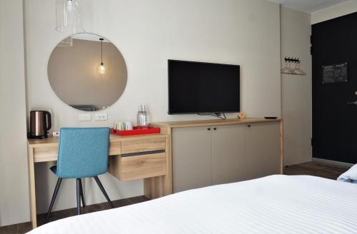 Ένα ή περισσότερα κρεβάτια σε δωμάτιο στο Grace Garden Coffee Homestay