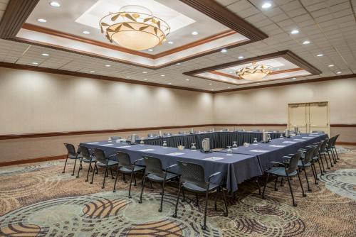 a conference room with a long table and chairs at Crowne Plaza Knoxville Downtown University by IHG in Knoxville