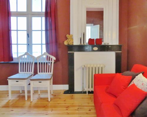 Ein Sitzbereich in der Unterkunft Huis Vandermersch