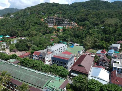 an aerial view of a city with a mountain at The Mantra Hotel Kata Noi in Kata Beach
