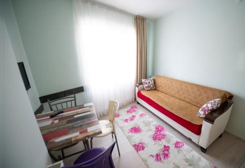 a small room with a bed and a window at Liman Apart Hotel in Isparta