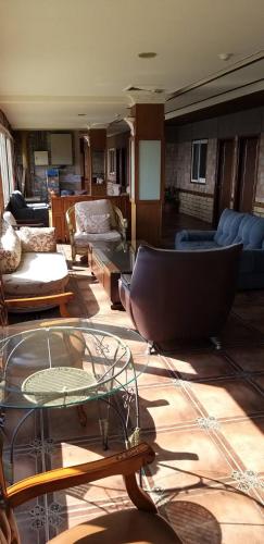 a living room with a couch and a table at Victoria Peak Garden Suburb in Renai