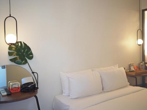 Ένα ή περισσότερα κρεβάτια σε δωμάτιο στο Wonderwall Hotel