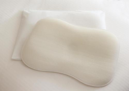 a white piece of paper on a white table at APA Hotel Kokuraeki Shinkansenguchi in Kitakyushu