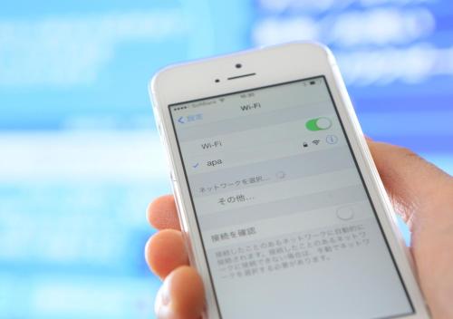 a person holding a cell phone in their hand at APA Hotel Kokuraeki Shinkansenguchi in Kitakyushu