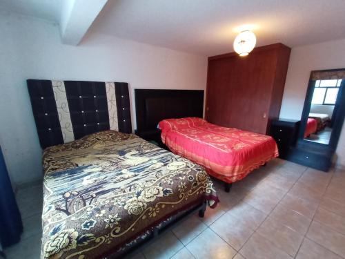 Postel nebo postele na pokoji v ubytování Toluca Casa Centrica