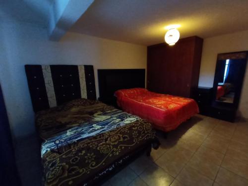 Una cama o camas en una habitación de Toluca Centrica House