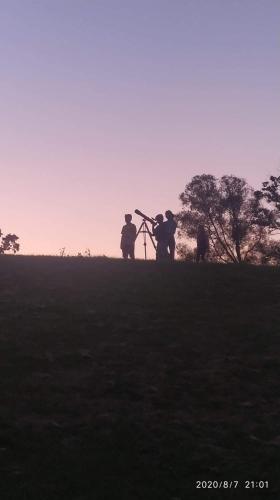 a group of three people standing on a hill at Agroturystyka u Świątków in Stara Kamienica