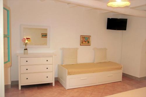 A bed or beds in a room at Villa Ginestra sulla spiaggia di Stromboli