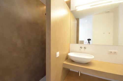 a bathroom with a white sink and a mirror at VILLA BONITA - REF 216 in Begur