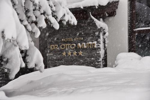 a sign for the detroit metro in the snow at Hotel Dr Otto Murr B&B in Sankt Anton am Arlberg