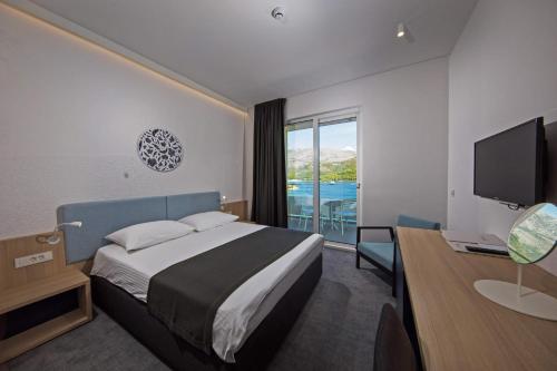 Postel nebo postele na pokoji v ubytování Hotel Osmine