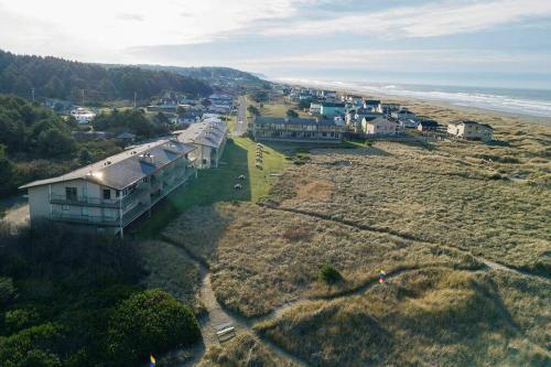 an aerial view of a house next to the beach at Heron Condo in Moclips