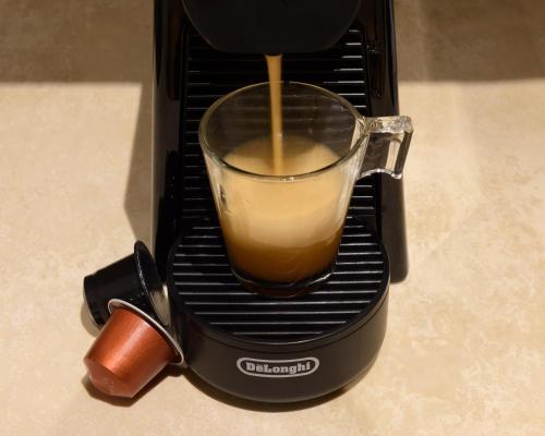 a cup of coffee is being brewed in a toaster at Hortus Conclusus + free parking in Siena