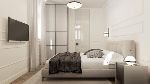 Ένα ή περισσότερα κρεβάτια σε δωμάτιο στο Plaza Apartments