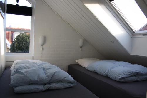 Llit o llits en una habitació de Holiday-Skagen