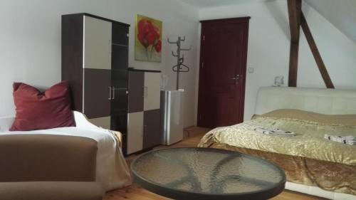 a living room with a couch and a table at Farma Hermína in Jilemnice