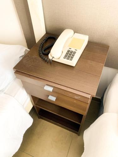 a phone on a desk in a hotel room at Hotel Artico in Mar del Plata