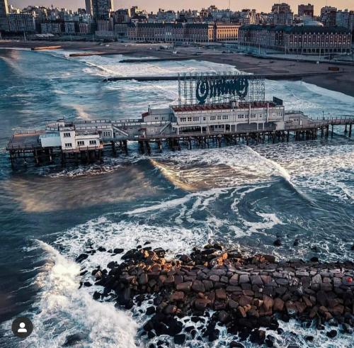 an aerial view of a pier in the ocean at Hotel Artico in Mar del Plata