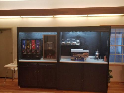 a display case in a room with books on it at Brook Pointe Resort in Syracuse