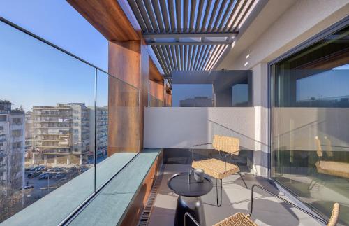 a room with a large window and a balcony at ONOMA Hotel in Thessaloniki