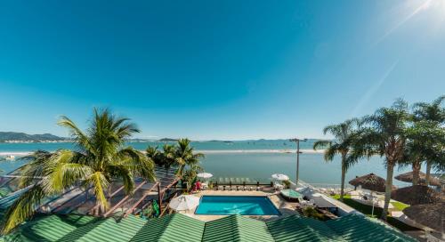 a view of the ocean from a resort at Costa Norte Ponta das Canas Hotel in Florianópolis