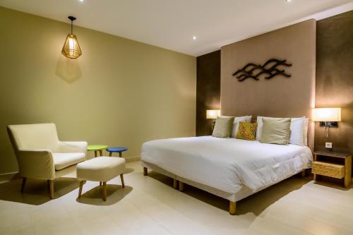 Cama o camas de una habitación en Baobab Tree Hôtel & Spa