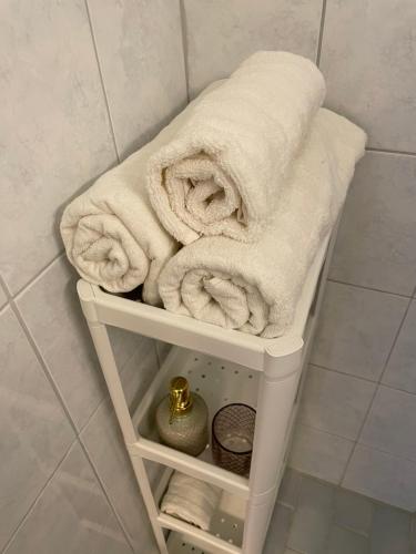 a towel rack with towels on it in a bathroom at Park View Apart in Kouvola
