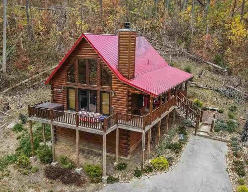an overhead view of a log cabin with a red roof at Christmas Bear in Gatlinburg