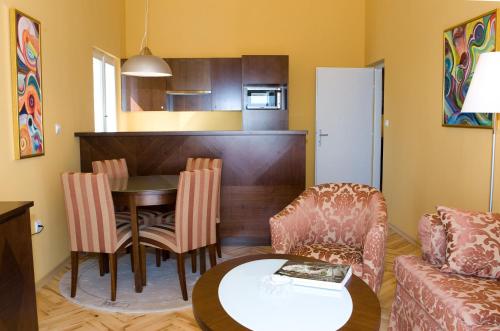 a living room with a table and a couch at Sipa Apartments in Dubrovnik