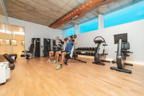 a group of people in a gym working out at Le Calette Garden & Bay in Cefalù