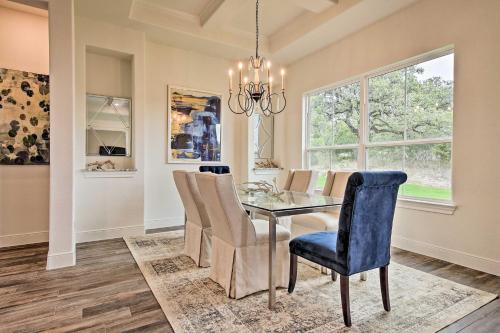 a dining room with a glass table and chairs at Cascada at Canyon Lake about 1 Mi to Wedding Venues! in Spring Branch
