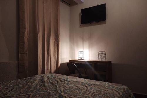 Katil atau katil-katil dalam bilik di Embajadoras Apartment & Rooftop