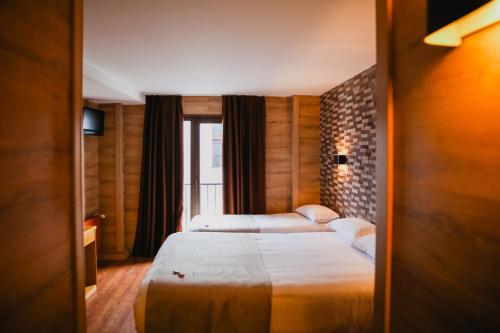 Cama o camas de una habitación en Cal Ruiz