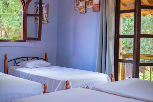 Cama o camas de una habitación en Hostel La Vieja Panaderia & Restaurant
