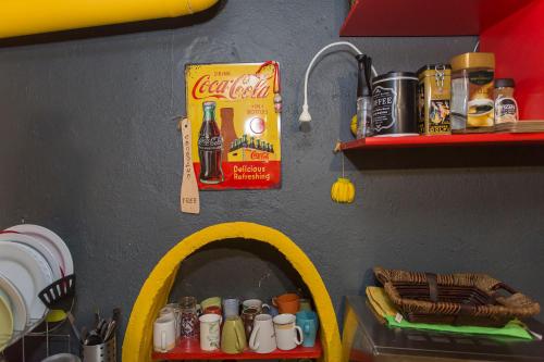 a kitchen with a play kitchen with a soda bottle at Social Guest House in Sofia
