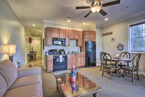 a kitchen and living room with a couch and a table at Resort-Style CondoandSuite on Golf Course with Pool! in Spring Lake