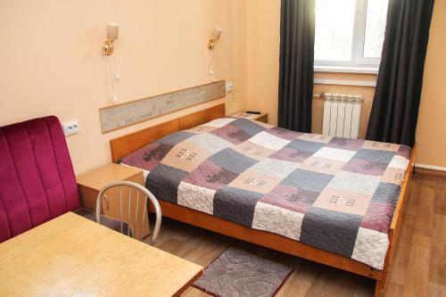 Ένα ή περισσότερα κρεβάτια σε δωμάτιο στο Parkovaya 9