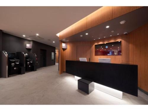 a lobby with a large black counter in a store at R&B Hotel Sendai Higashiguchi - Vacation STAY 14656v in Sendai
