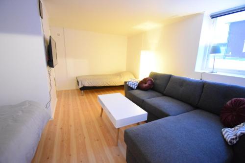 a living room with a couch and a table at Apartment nr 7 in Kiruna C in Kiruna