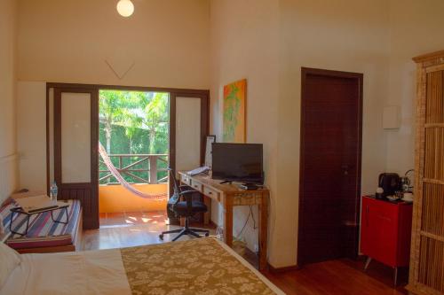 TV/trung tâm giải trí tại Pousada Vila Tamarindo Eco Lodge
