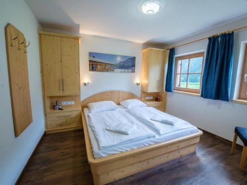 a bedroom with a large bed in a room at Chalet in Austria near Ski Lift & Sauna in Wald im Pinzgau