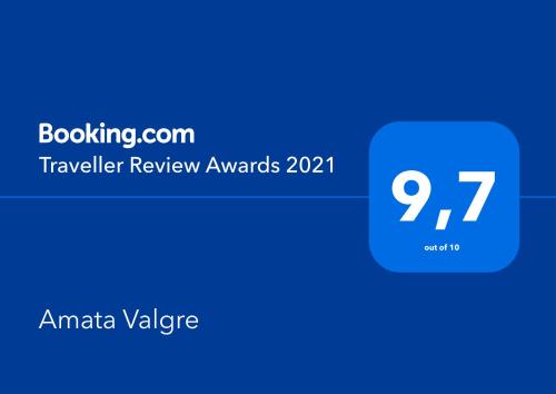 a blue cylinder with the text travel review awards at Amata Valgre Affittacamere, comfort e pulizia eccezionali!! in Olginate