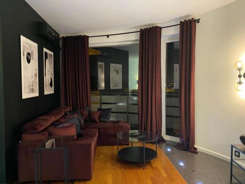 a living room with a couch and a table at Family & Business Sauna Apartments Klonowa nad Zalewem, Unikat SPA - 2 Bedroom with Private Sauna, Jacuzzi, Air Conditioning, Garage - The Highest Standard! in Kielce