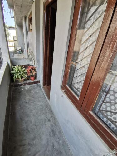 an entrance to a house with a door at Bhaskar Homestay in Dibrugarh