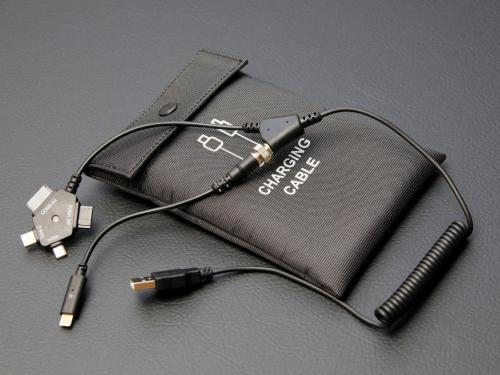 a charger is plugged into a cell phone at QuintessaHotel FukuokaTenjin Comic&Books in Fukuoka