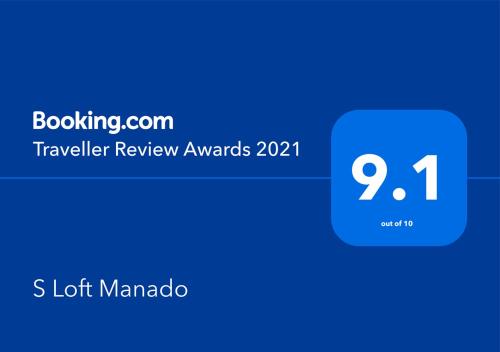 a blue box with the text travelling review awards at S Loft Manado in Manado